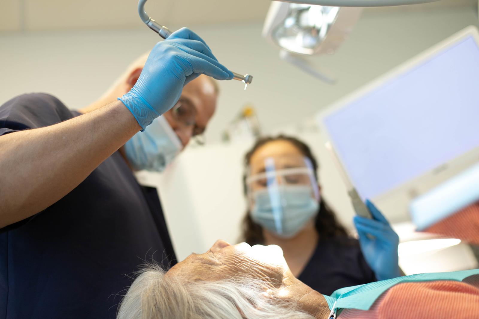 Dental professionals treating patient
